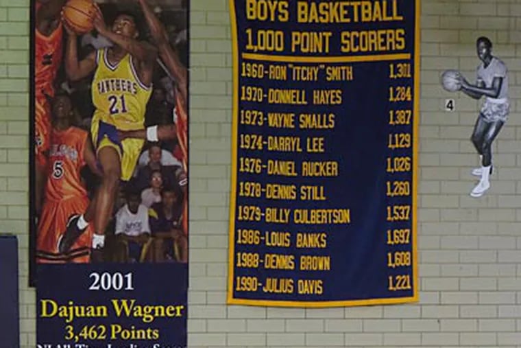 A banner in Camden's gym notes Dajuan Wagner's high school scoring record. (Marc Narducci/Staff)