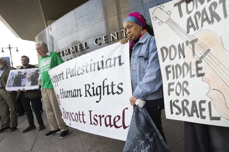 Protesters outside the Kimmel Center after the Philadelphia Orchestra’s Friday matinee called on the orchestra to cancel its concerts in Haifa, Tel Aviv, and Jerusalem.