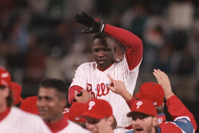 Kim Batiste was carried off the field by teammates after knocking in John Kruk from second base with the winning run with a single in the 10th inning to give the Philadelphia Phillies a 4-3 win over the Atlanta Braves in Game 1 of the National League Championship Series at Veterans Stadium on Oct. 6, 1993.