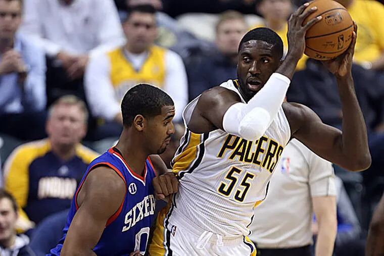 Pacers center Roy Hibbert posts up against 76ers forward Brandon Davies. (Brian Spurlock/USA Today Sports)