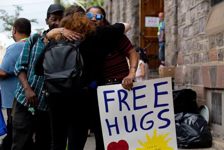 Roz Pichardo gives out free hugs at Prevention Point in Kensington Wednesday, August  28, 2019. Prevention Point Philadelphia and 30 partner organizations provided food, Narcan overdose reversal kits, Hepatitis and HIV tests, and a wide variety of services and resources from organizations across the city, all for free at a neighborhood block party.