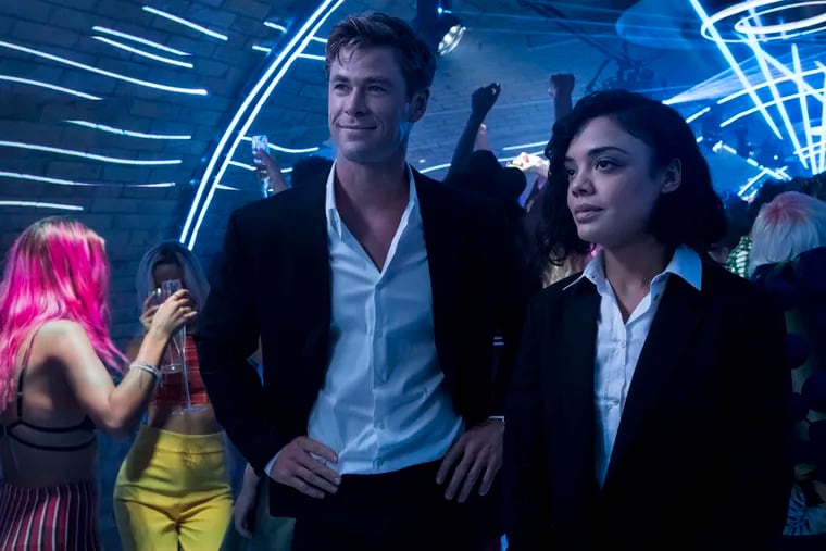This image released by Sony Pictures shows Chris Hemsworth, left, and Tessa Thompson in a scene from Columbia Pictures' "Men in Black: International." (Giles Keyte/Sony/Columbia Pictures via AP)