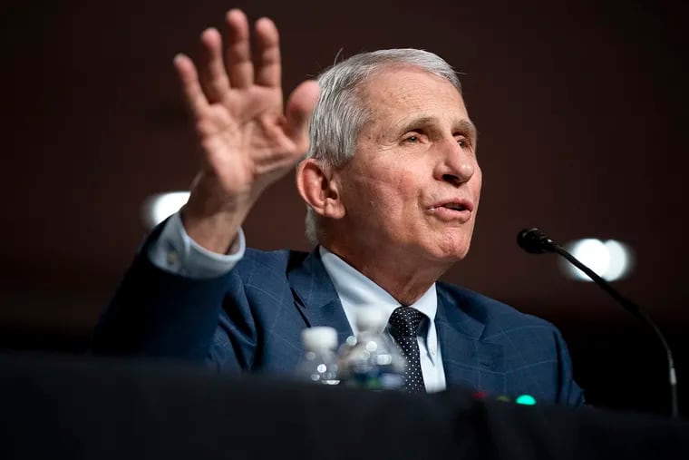 Anthony Fauci, shown testifying on Capitol Hill in January, said Tuesday that the U.S. was 'out of the pandemic phase,' then later tempered his remarks.