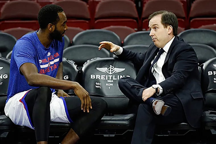 76ers forward Luc Mbah a Moute and general manager Sam Hinkie. (Yong Kim/Staff Photographer)