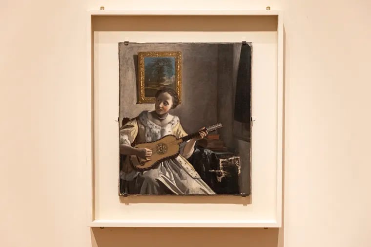 "Lady with a Guitar" on display at the Philadelphia Museum of Art. New research argues that it is an original painting by Johannes Vermeer, not a copy, as experts previously agreed.