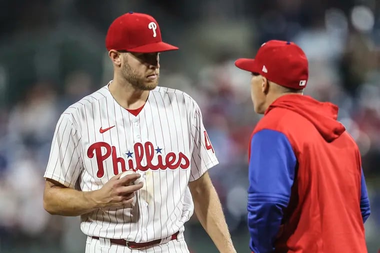 Phillies pitcher Zack Wheeler gets ready to hand the ball off to manager Joe Girardi after pitching to the Rangers during the 7th inning at Citizens Bank Park in Philadelphia, Wednesday, May 4, 2022  Ranger sweep the two game series beating the Phillies 2-1 in 10 innings.