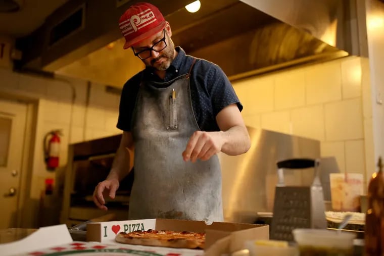 At 8:24 p.m. Thursday, Joe Beddia finishes one of his 40 pizzas at Pizzeria Beddia in Philadelphia.