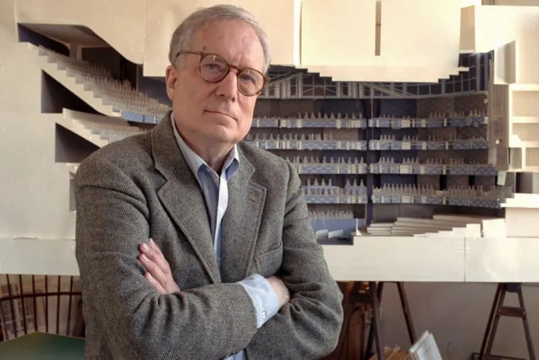 In this April 1991 photo, architect Robert Venturi poses in his Manayunk office with a model of a concert hall for the Philadelphia Orchestra. The project was never built.