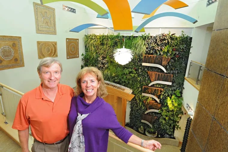 Dansko's founders and owners, Peter Kjellerup and wife Mandy Cabot, in the atrium of the company's headquarters.