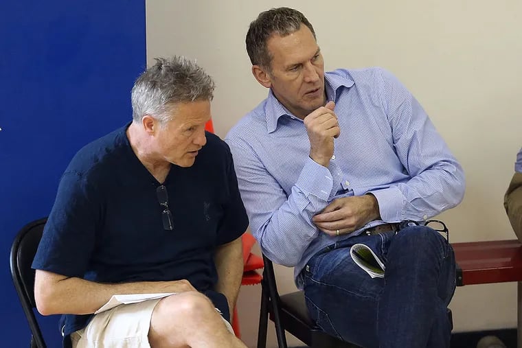 Sixers head coach Brett Brown talks with president of basketball operations Bryan Colangelo during a Sixers pre-draft workout.