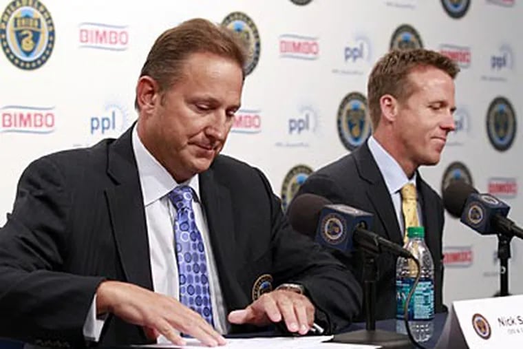 Union CEO Nick Sakiewicz (left) named John Hackworth the interim team manager in June. (Yong Kim/Staff Photographer)