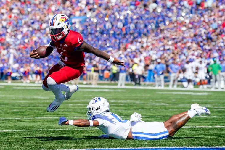 Jalon Daniels of the Kansas Jayhawks runs for a touchdown past Chandler Rivers of the Duke Blue Devils during the second half at David Booth Kansas Memorial Stadium on September 24, 2022 in Lawrence, Kansas. Kansas defeated Duke 35-27. (Photo by Jay Biggerstaff/Getty Images)