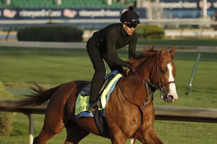 Kentucky Derby hopeful Justify runs during a workout at Churchill Downs in Louisville, Kentucky, on Tuesday. Justify drew the seventh post position.