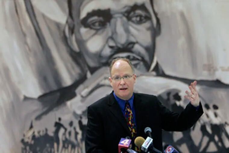 Paul Vallas addresses an audience in New Orleans yesterday after being introduced as superintendent.