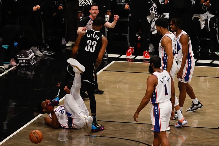 Sixers center Joel Embiid kicks Brooklyn Nets center Nic Claxton during the first quarter in Game 3. Embiid was assessed a Flagrant 1 foul for his actions.