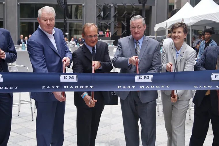 From left, SSH Real Estate partner Pete Soens, IBEW Local 98 business manager John Dougherty, National Real Estate Advisors president and CEO Jeffrey Kanne, Mayor Jim Kenney, Philadelphia planning director Anne Fadullon and Young Capital President Michael Young, at the November ribbon cutting for the East Market project's first phase.