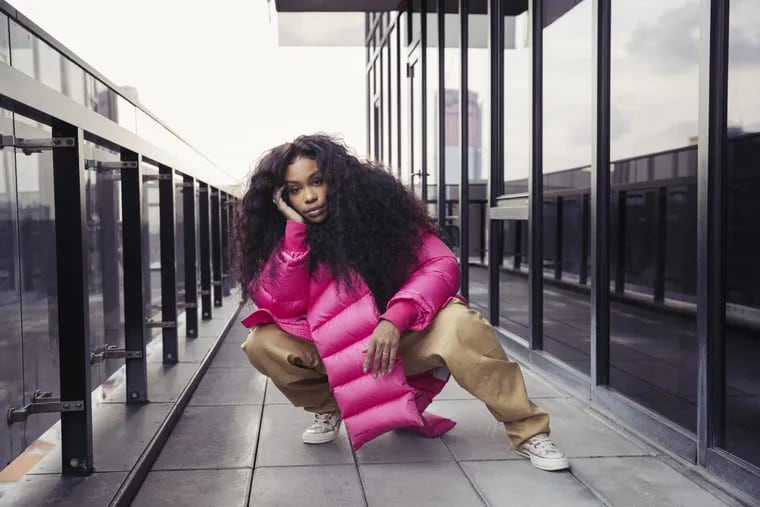In this Dec. 4, 2017 photo, singer SZA poses for a portrait in New York to promote her latest album, &quot;Ctrl.&quot; SZA is nominated for five Grammy Awards for her debut album â€œCtrl.â€ (Photo by Victoria Will/Invision/AP)