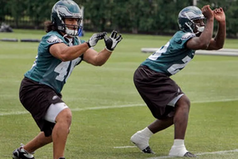 &quot;Right now, the biggest thing to worry about is learning the offense,&quot; says rookie running back Tony Hunt (right), who joined fellow draftee Nate Ilaoa in a training drill yesterday.