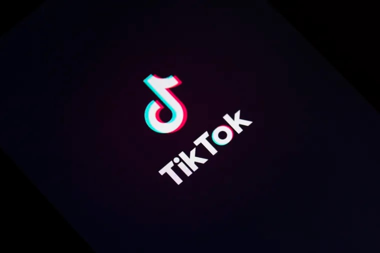 A TikTok logo on a mobile device