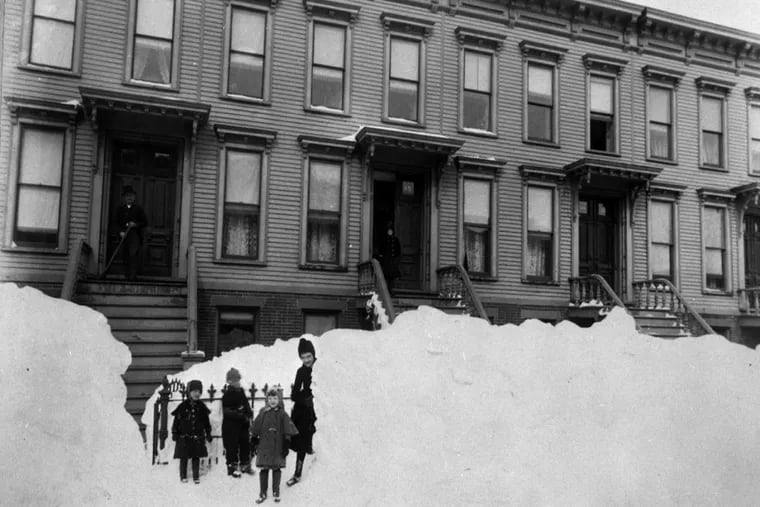 Photo of a residential street in Brooklyn, NY after the Blizzard of 1888.