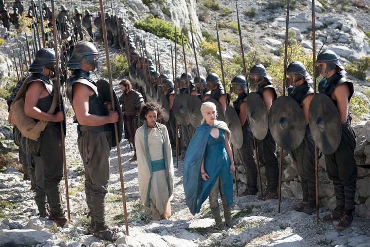 "Game of Thrones," Season 4: Daenerys Targaryen (in blue, walking with Missandei, played by Nathalie Emmanuel), continues building her army to conquer King's Landing.
