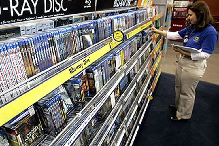 Lower prices for Blu-ray players - as little as $78 for a basic model that also plays regular DVDs - have been a great sales motivator. But it's really the expanded depth and diversity of high-def Blu-ray disc titles that's driving many to finally convert. (AP Photo / Paul Sakuma)