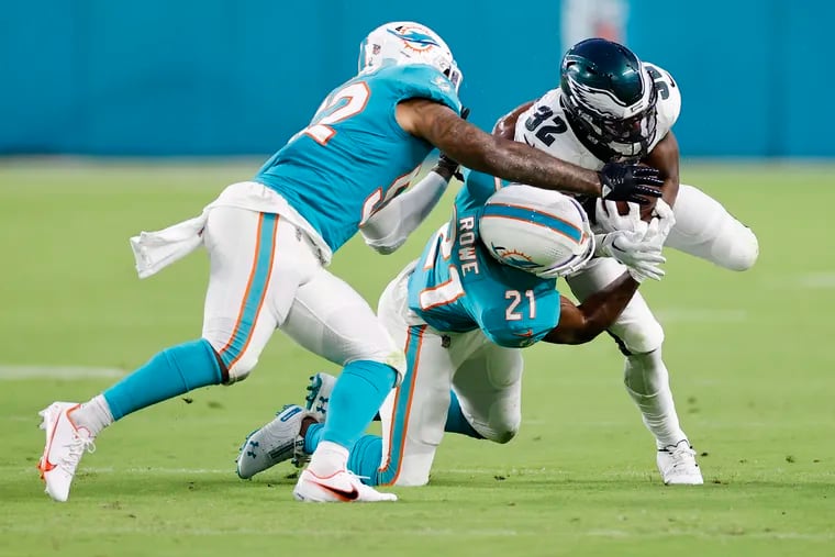 Eagles running back Jason Huntley rushes the ball in second quarter against Miami Dolphins.