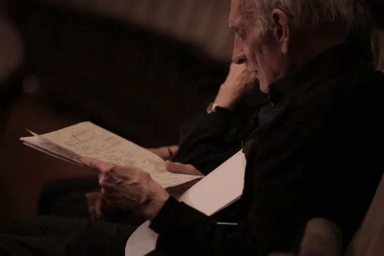 Philly composer George Crumb, looking over a score during the dress rehearsal for Sunday's retrospective at Lincoln Center.