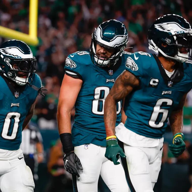Philadelphia Eagles running back D'Andre Swift (0) celebrates a fourth quarter touchdown against the Vikings with teammates A.J. Brown (11), tight end Dallas Goedert (88), and wide receiver DeVonta Smith (6).