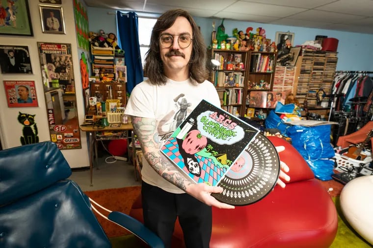 Perry Shall in his studio with the album cover design for which he was nominated for a Grammy. Shall does all the artwork design for Easy Eye Sound, the Nashville record label owned by Dan Auerbach of the Black Keys.
