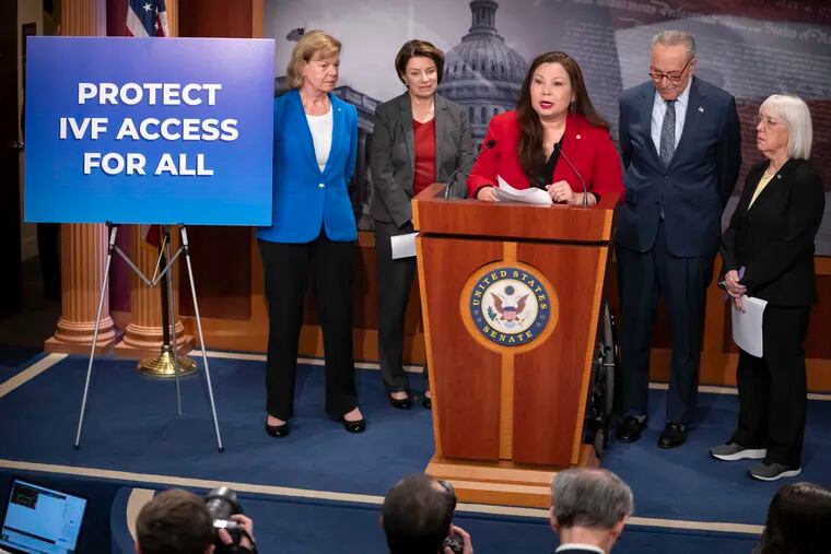 Sen. Tammy Duckworth, D-Ill., center, speaks about a bill to establish federal protections for IVF as, from left, Sen. Tammy Baldwin, D-Wis., Sen. Amy Klobuchar, D-Minn., Senate Majority Leader Chuck Schumer of N.Y., and Sen. Patty Murray, D-Wash., listen during a press event on Capitol Hill in Washington.