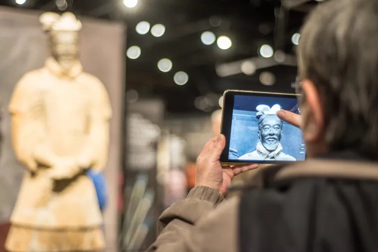 Visitors to the Franklin Institute exhibit “Terracotta Warriors of the First Emperor” can point their smartphone cameras at the figures to view details like a bow wielded 2,200 years ago.
