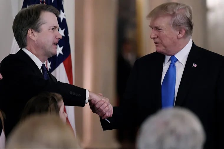 U.S. President Donald Trump shakes hands with Judge Brett Kavanaugh with after he nominated him to the Supreme Court during a ceremony in the East Room of the White House on Monday night.