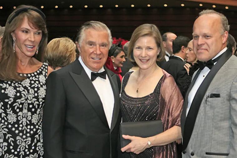 The Kimmels (left), Caroline and Sidney, with center president and CEO
Anne Ewers and Fred Hagen at the orchestra's opening night in September. (Akira Suwa / Staff Photographer)