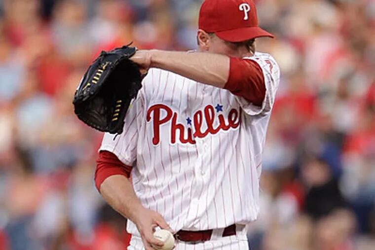 Pitcher Roy Halladay was placed on the disabled list with a right shoulder and back muscle strain. (Matt Slocum/AP Photo)