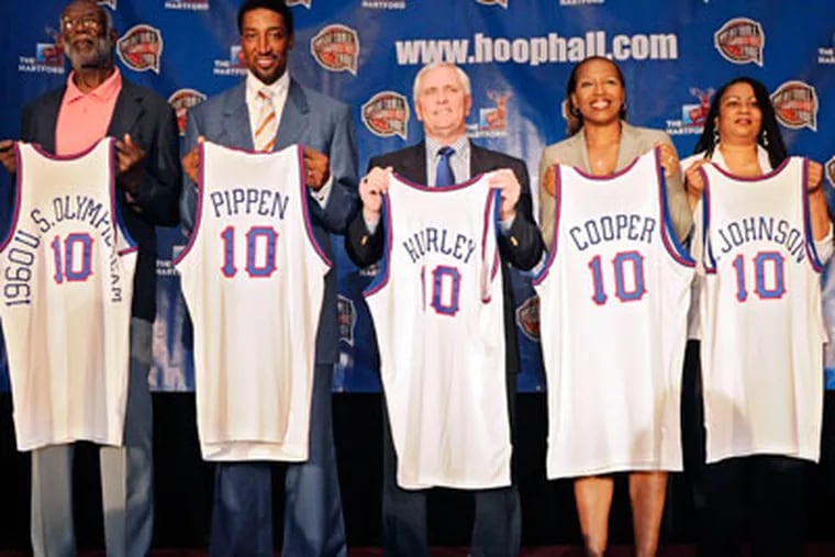 Bob Hurley Sr. (center) is only the third high school coach to be selected for the Hall of Fame. (Mark J. Terrill/AP)
