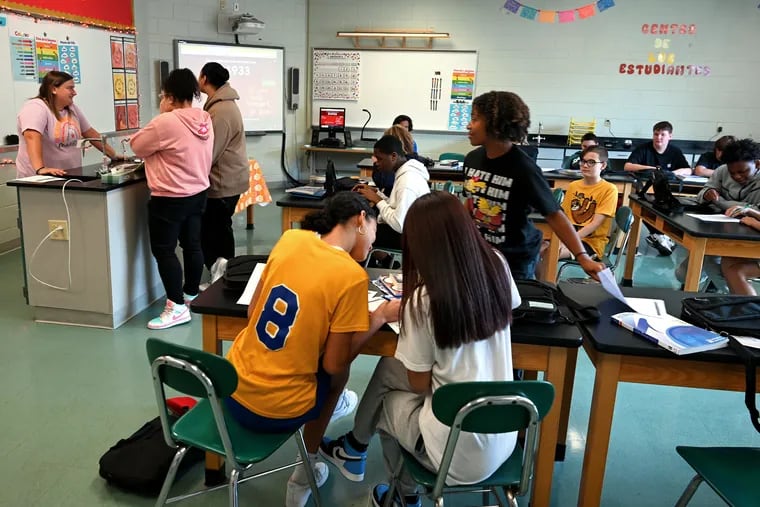 Spanish teacher Kayla Dauria (left) talks with students in her classroom for a study hall at Lumberton Middle School Tuesday, Oct. 3, 2023. Students returned to their school Tuesday after mold remediation.