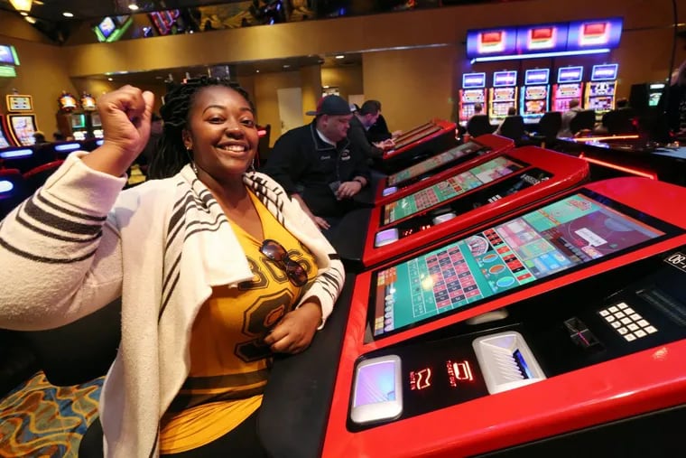 Jennifer Morgan, of Jersey City, celebrates as she plays roulette from a kiosk at Resorts Casino Hotel, in Atlantic City, Friday, May 18, 2018. VERNON OGRODNEK / For the Inquirer