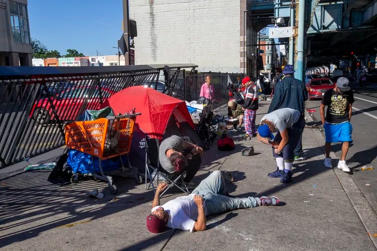 Tents belonging to people experiencing homelessness line the sidewalk along Kensington Avenue near E. Hilton St. in June.