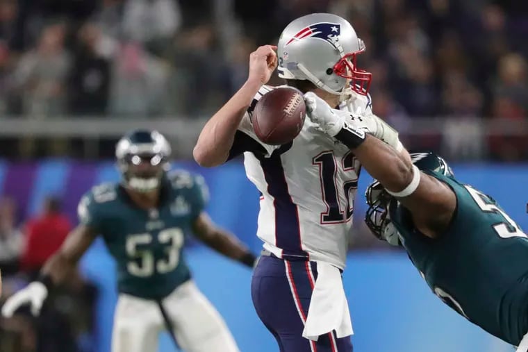 Eagles defensive end Brandon Graham forced a fumble by quarterback Tom Brady during the fourth quarter of Super Bowl LII in February 2018.