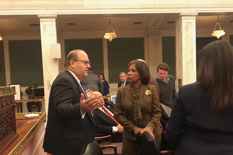 Councilman Allan Domb talks with Councilwoman Blondell Reynolds Brown after a hearing on a bill Wednesday, which would require an LLCs to disclose it backers in order to get rental licenses in the city. Domb voted against the bill which Brown introduced.