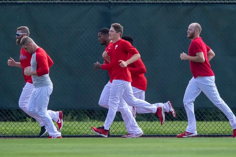 Phillies top prospect Spencer Howard, center, is hoping to build up a workload that will allow him to run with the rest of the pitchers in the starting rotation.
