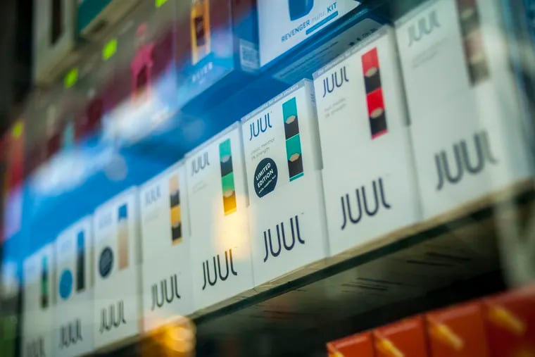 A selection of the popular Juul brand vaping supplies on display in the window of a vaping store in New York on Saturday, March 24, 2018.