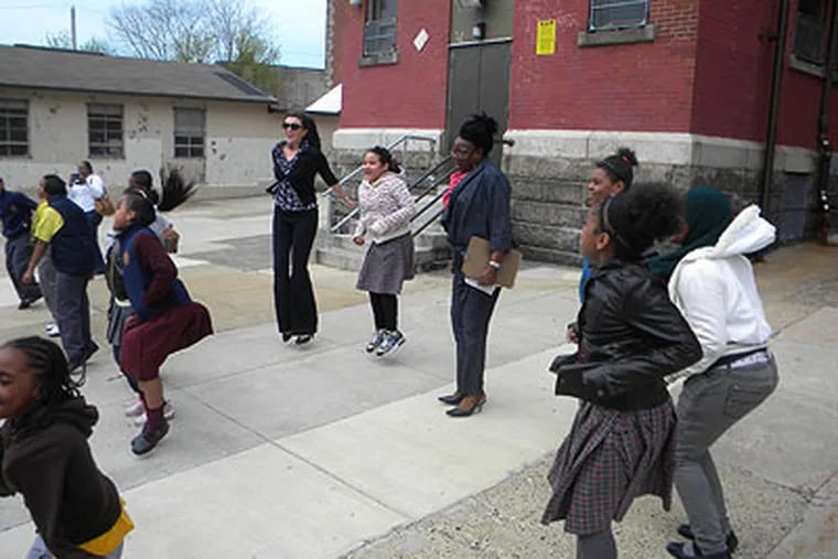 Students at Fitler Elementary School in Philadelphia jump to simulate an earthquake.
