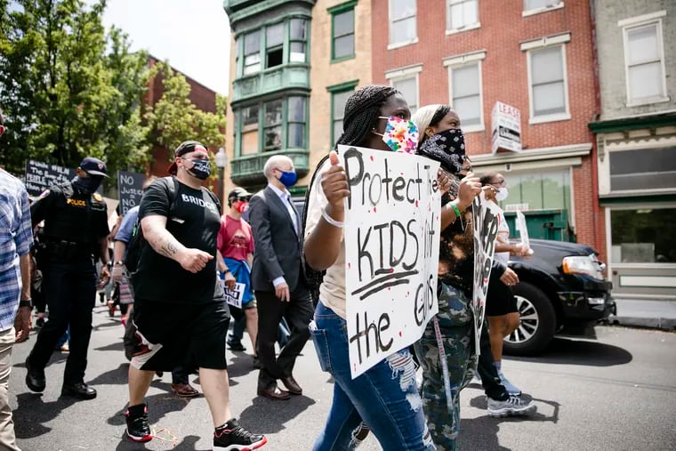 Gov. Tom Wolf marched with demonstrators against police brutality in Harrisburg on June 3, 2020. State legislators are currently considering four bills on police reform.