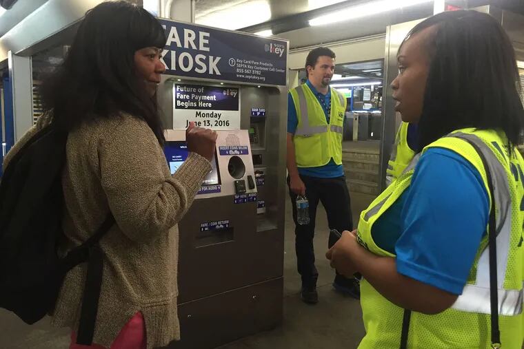 Shirley Thomas gets advice from Norma Clark, a SEPTA ambassador, about the new smart fare card. The early adopter program is phasing in SEPTA Key, the smart card that will replace tokens and TransPasses for subways, trolleys, buses, and rail.