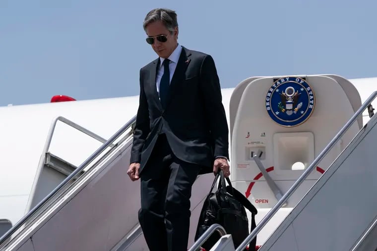 Secretary of State Antony Blinken steps off his plane upon arrival at Cairo International Airport on, Wednesday.