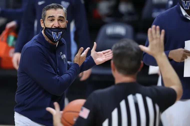 Coach Jay Wright, left,  of Villanova argues with an official during the Wildcats' 85-66 victory over Butler.