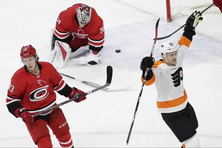 Jordan Weal celebrates his game-winning goal in overtime as the Flyers won a critical game in Carolina on Tuesday.