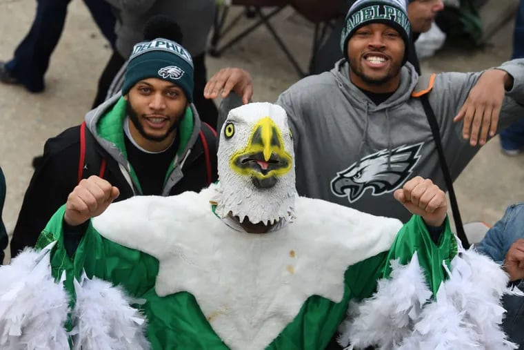 Eagles fans on Broad Street cheer hours before the start of the Eagles Super Bowl parade on Thursday.